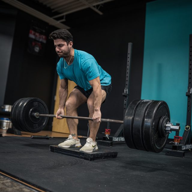 deadlifting on a free trial at drip athletic club